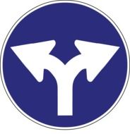 Blue and white traffic sign with arrows