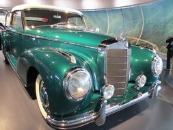 green retro car in the museum