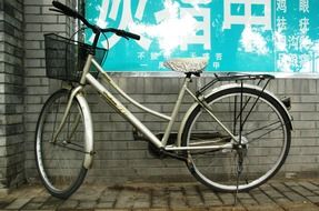 white bike near the wall