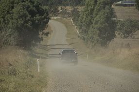dust over road after the car, australia