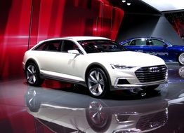 white Audi car in the car showroom