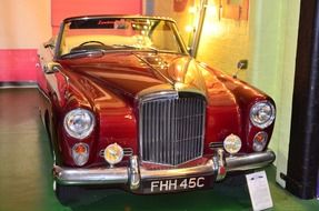 classic red car in a museum in london