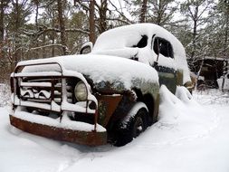 Vintage truck abandoned in the snow