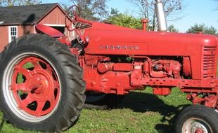 red tractor on green grass