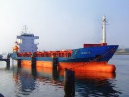 orange ship at the port in Rotterdam