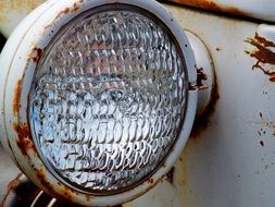 headlight of an old tractor close up
