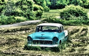 blue retro car in the field
