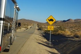 road sign with a picture of a turtle