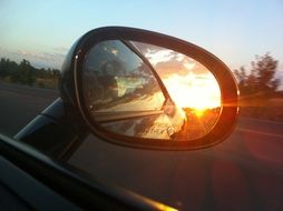sunset in the rear view mirror