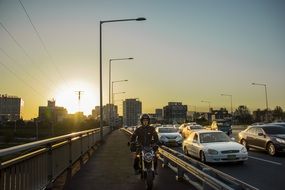 motorcycle ride on the bridge at dusk