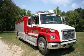 red and white fire truck on lawn