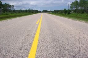 yellow markings on an asphalt road