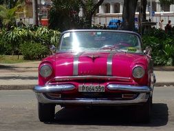 red pink car in Cuba