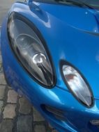 headlights of blue contemporary car close up