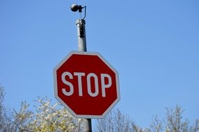 road sing stop and camera