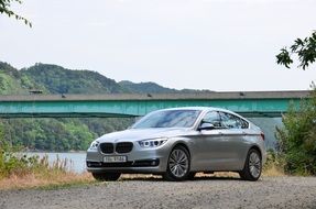 car of silver color among nature