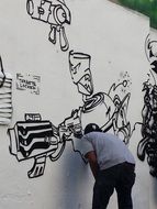 man draws on the wall