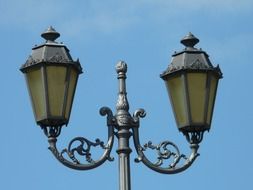 two street lamps on one post