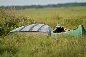 two boats on a green meadowr