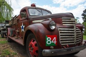 Colorful antique vehicle with number "84"