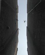 helicopter between buildings