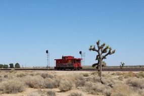 locomotive on railroad in mojave desert on a sunny day