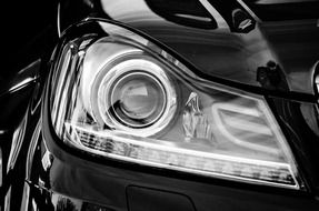 headlight on a black car close up