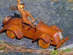 wooden toy car with driver