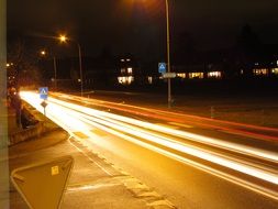 bright light from car headlights on the highway