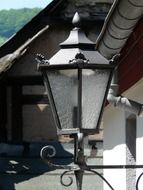 street lamp on the background of the house