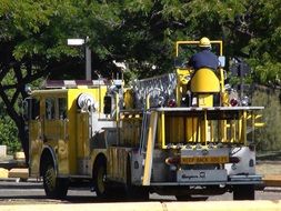 yellow fire truck on a city street