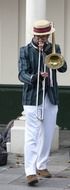 street musician plays the trumpet