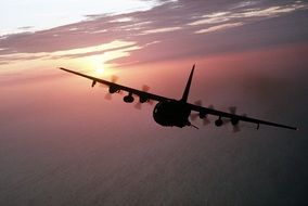 ac-130 cargo plane in the air