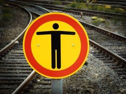 warning traffic sign on railroad