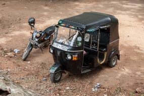 black tricycle and motorcycle