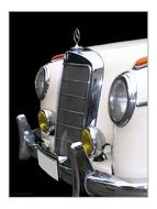 front of a white vintage car