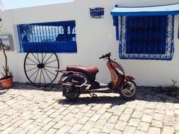 scooter near a small house