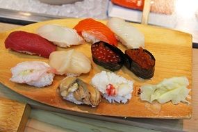 Different kinds of sushi on a wooden board