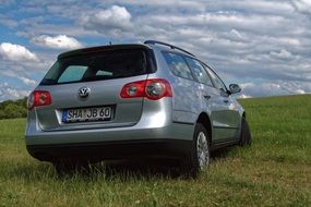 Volkswagen car stands on the green grass