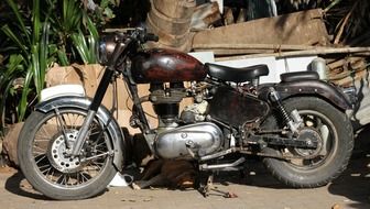 motorcycle near the wooden fence