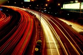 bright lights of cars on road at night, long exposure