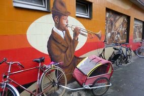 dark skin trumpeter, mural on wall