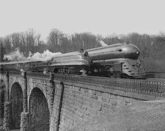 black and white photo of the train on the railway