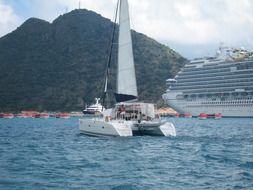 white catamaran on the water