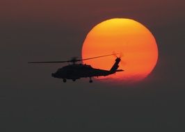 helicopter military sunset