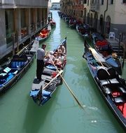 gondola with passengers on the channel, italy, venice