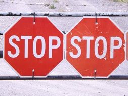 two red stop signs