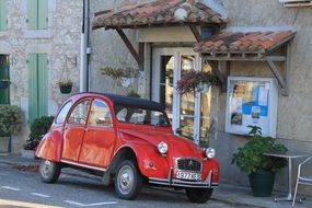 vintage car stands near the cafe