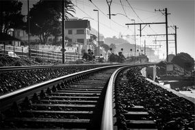 black white photo railroad tracks