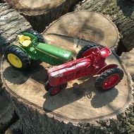 Colorful tractors on the wood